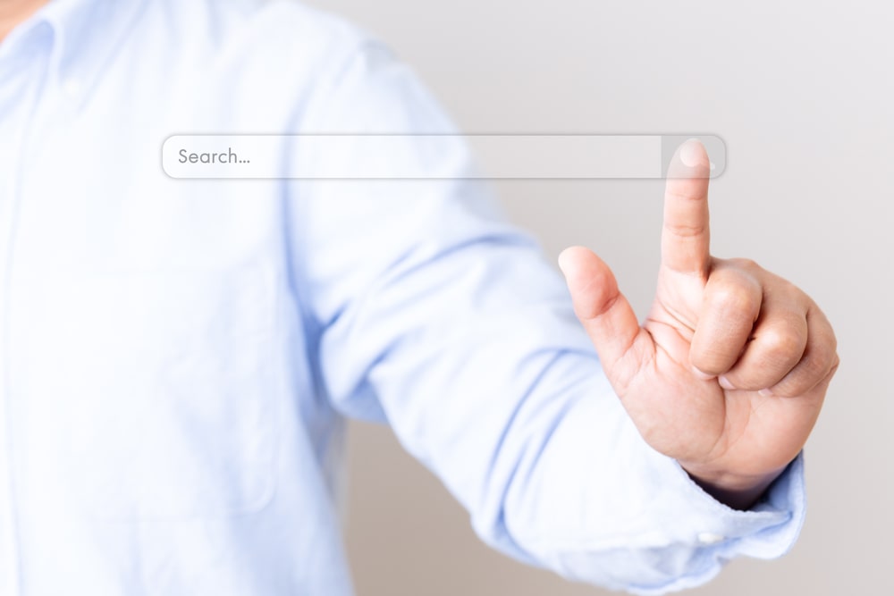 Person Clicking On A Digital Search Button