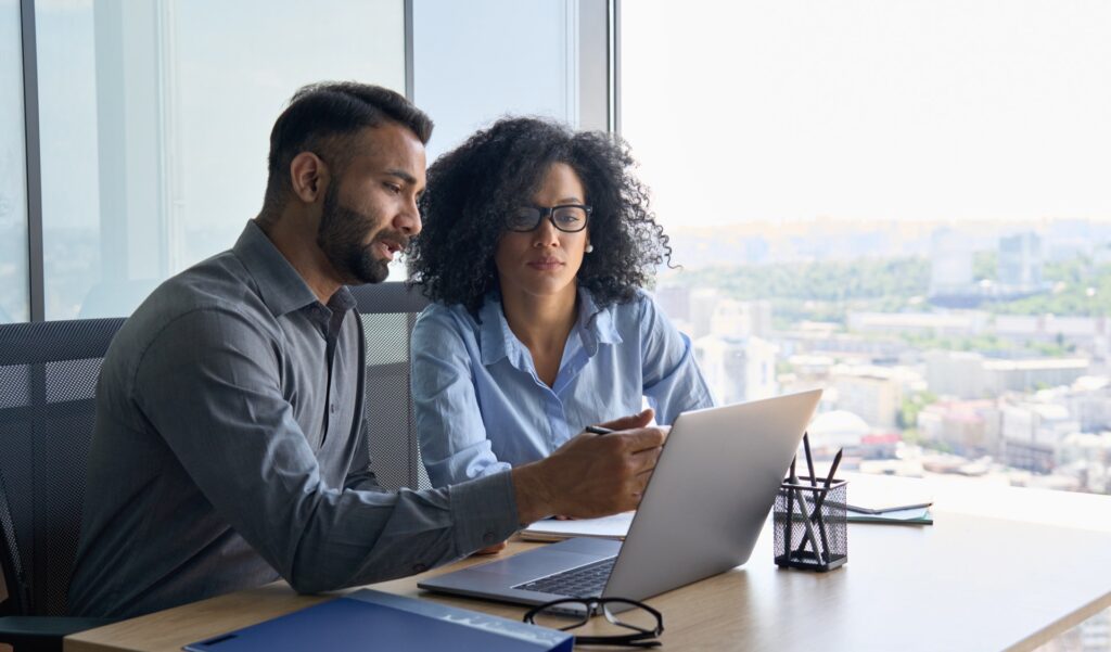 Couple Discussing Something On The Laptop