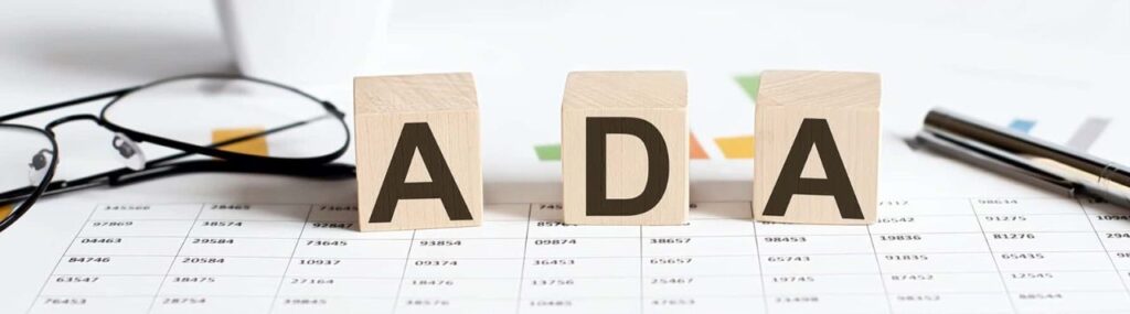 Wooden letter blocks forming the word ADA